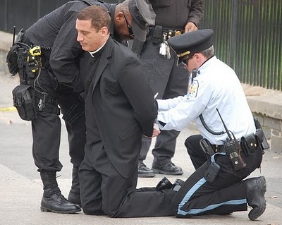Priest in cuffs.jpg